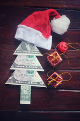 Christmas tree of dollar with gifts