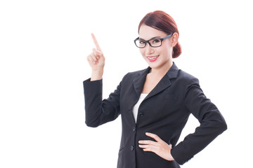 Portrait of young businesswoman wearing glasses pointing up on white background