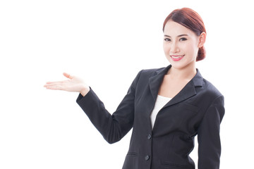 Smiling young businesswoman showing blank area for sign or copyspase over white background