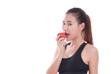 Fitness woman aeting apple on white background. healty concept