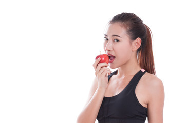 Naklejka premium Fitness woman aeting apple on white background. healty concept