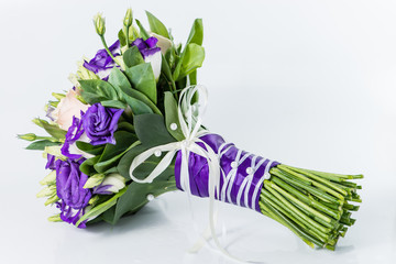 Close-up of bridal bouquet in purple tones isolated on white bac