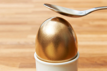Spoon Cracking Golden Egg