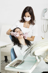 Dentist examining a patient's teeth.copy space