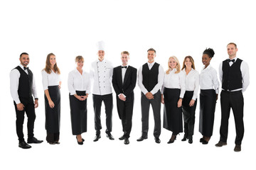 Fototapeta na wymiar Portrait Of Confident Restaurant Staff Standing In Row