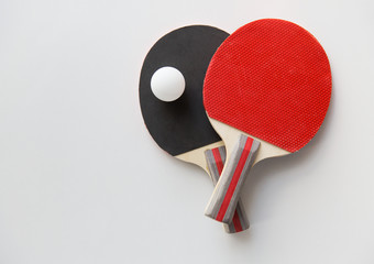 close up of table tennis rackets with ball