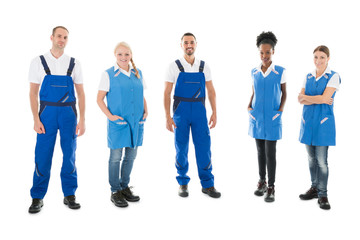 Fototapeta premium Portrait Of Confident Multiethnic Janitors Standing In Row