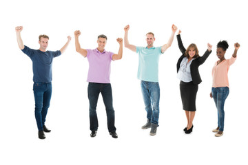 Obraz premium Creative Business Team With Arms Raised Celebrating Success