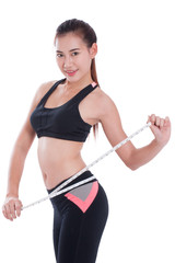 Fototapeta na wymiar Fitness young woman taking measurements of her body. healthy concept