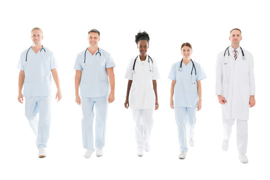 Confident Multiethnic Medical Team Walking In Row