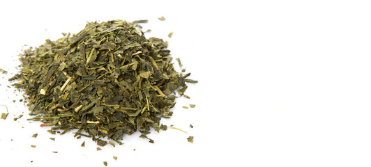 Dried Japanese green tea over white background