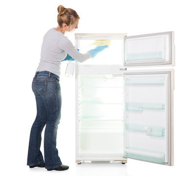 Young Woman Cleaning Refrigerator