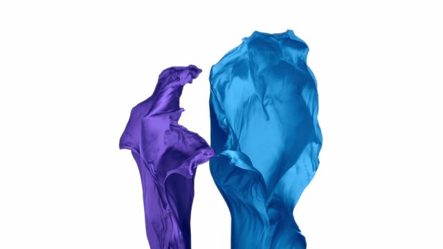 Blue and purple fabric flowing in the air on white background shooting with high speed camera, phantom flex.