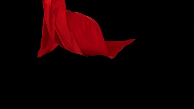 Red fabric flowing in the air on black background shooting with high speed camera, phantom flex.