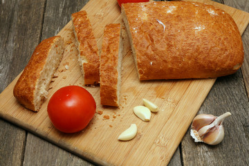 sliced ciabatta on a wooden background