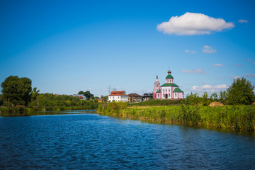 Fototapeta premium Russia. Suzdal. View of the river Kamenka and Church of St. Elias