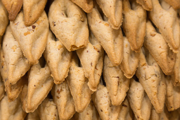 biscuits piled pyramid on Vetrin in store. French pastries.