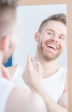 Handsome Man Applying Perfume