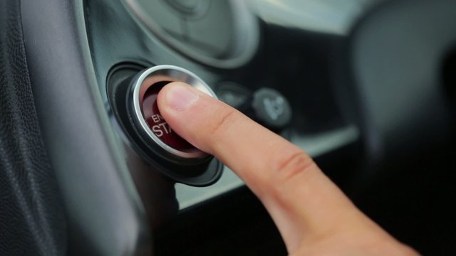 Car driver starting the engine