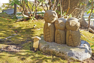 Three stone monk sculpture in Japanese style