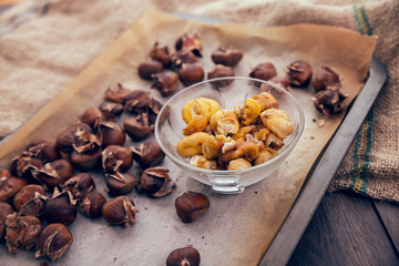Healthy winter snack chestnuts on wooden background