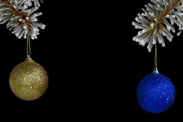 Christmas balls on the Christmas tree on a black background