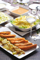 Baked salmon with florence fennel and salad on  Festive/Christmas table