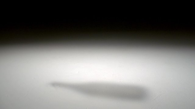 Dropping and smashing glass bottle shooting with high speed camera, phantom flex.