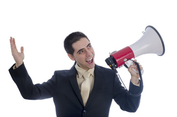 Man dressed in suit and tie shouting through megaphone.