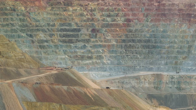 Time-lapse shot of mining trucks in giant open pit mine in New Mexico, USA
Speeded up dump trucks removing excavation spoil from Chino Copper Mine