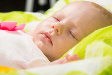 Obraz na płótnie Canvas Close-up of a sleeping baby in the crib