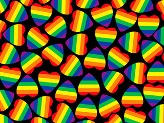 Set of multicolored hearts shape with gay pride flag inside on black.