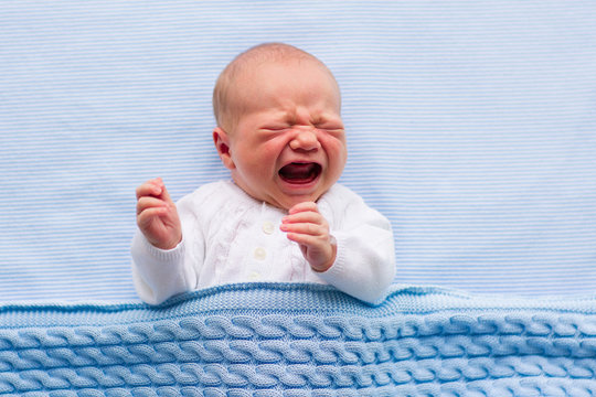 Newborn Baby Boy On A Blue Blanket