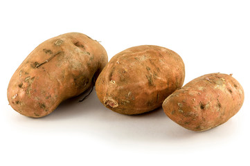 Organic Sweet potatoes on white background
