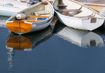 White Rowboats Reflecting in Water