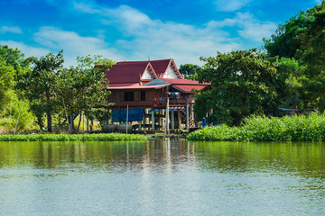 Fototapeta na wymiar House on the river Nakhon Chai Si