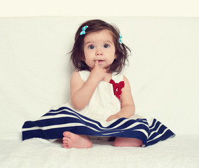baby girl portrait, sit on white towel