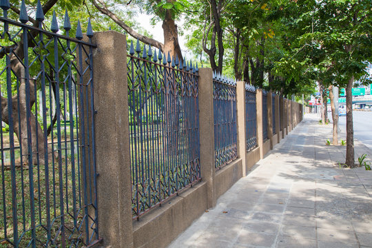 The iron fence on a green background .