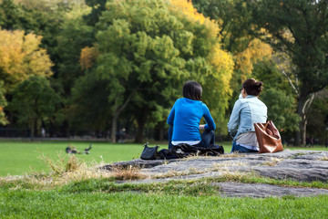 Two girls having a break in Central Park, Manhattan, New York.