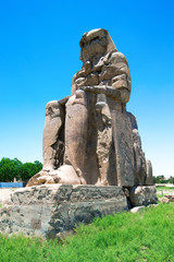 Fototapeta na wymiar two massive stone statues of Pharaoh Amenhotep III