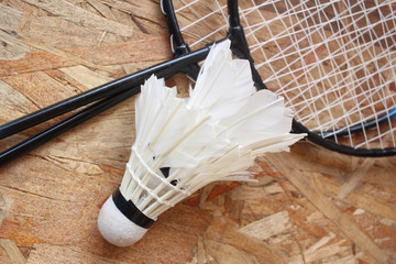 Shuttlecocks with badminton racket.