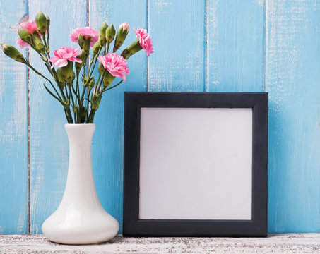 Blank frame and pink flowers