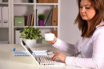 Young businesswoman working on a laptop