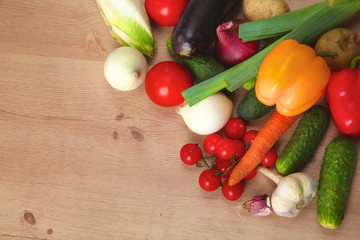 Pile of organic vegetables on a wooden table
