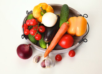 Fresh autumn vegetables on a white background
