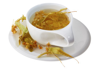 Cup of linden tea with linden flowers isolated on white background