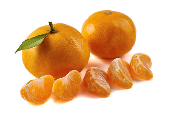 Group of tangerines with slices isolated on white background