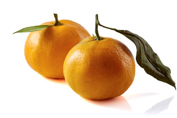 Tangerines with leaves isolated on white background