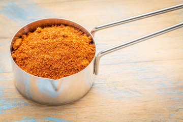paprika powder on measuring scoop