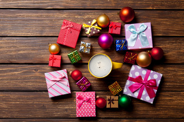 Cup of coffee and Christmas gifts